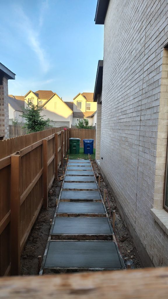 Side yard paver walkway installation in progress