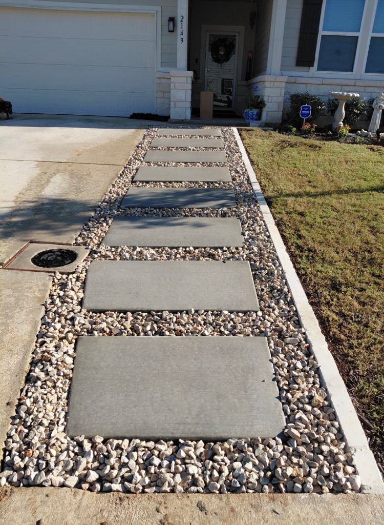 Modern paver walkway with decorative white rock landscaping